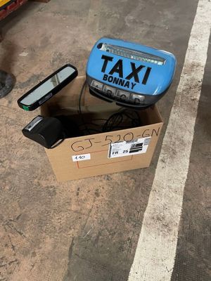 a box that has a phone in it on the ground