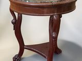 a small table with a marble top on a white background