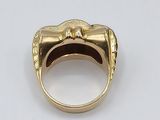 an image of a gold ring with a skull on it