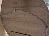 a large wooden object hanging on the wall