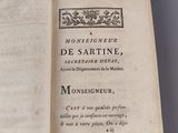 an open book with a black and white image of a man ' s face on it