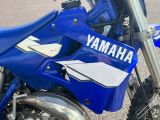 a close up of a yamaha motorcycle parked on the street