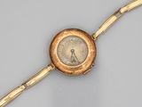 an image of a close up of a wrist watch on a white surface