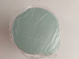 a cake that is wrapped in plastic on the table
