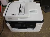 a printer that is sitting on top of a desk