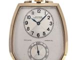 an image of a gold watch with a white face and black hands