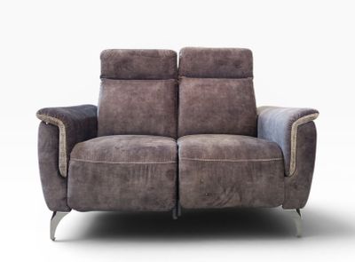 the two seat reclining loveseat is made of leather and has a metal frame