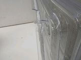 a stack of clear plastic plates sitting on a counter