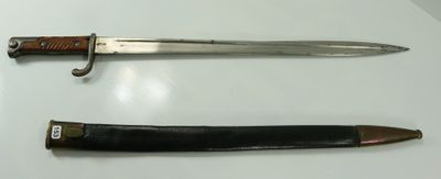 two different types of knives on display on a table