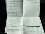 a close up of a person ' s hand holding a receipt