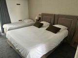 two beds that are made up in a hotel room