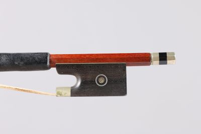 a close up of a violin bow on a white background