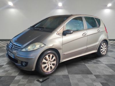 a picture of a silver car parked in a garage