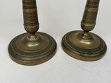 pair of antique brass candlesticks with ornate designs