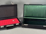 two open briefcases sitting side by side on a table