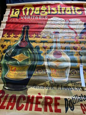 a large poster of a bottle of liquor on the wall
