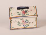 a small box that has a flower design on it
