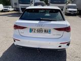 a white car that is parked in a parking lot