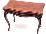 a small table with a wooden top on a white background