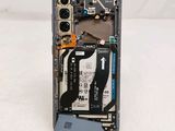 a cell phone with a broken battery attached to it