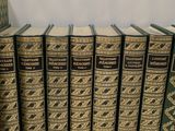 a lot of books that are sitting on a table