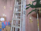 a ladder that is leaning against a wall in a room