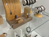 a display case with many different jewelry items on it