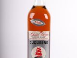 an image of a bottle of liquor sitting on top of a table