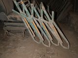 a pile of old tools sitting in the dirt