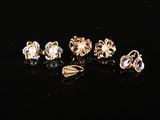 a set of five pairs of earrings and a ring