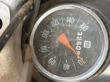 a close up of a speedometer on a motorcycle