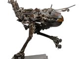 sculpture of an ostrich made of metal on a wooden base
