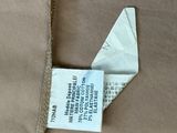 a brown jacket with a label on it and a tag on it
