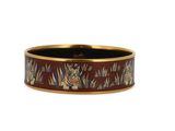 a close up of a ring with a tiger design on it