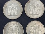 four silver sovereigns of the british empire