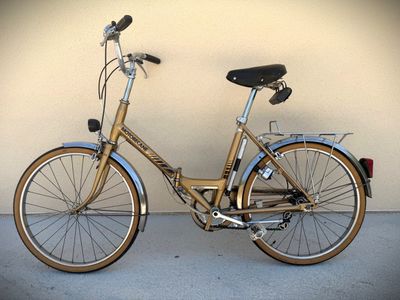 a bike that is parked against a wall