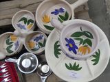 a lot of bowls and spoons that are on the table