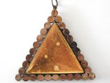 an image of a triangle shaped pendant hanging from a chain