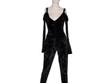 a mannequin wearing a black velvet jumpsuit on a white mannequin mannequin