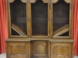 an image of a wooden bookcase with glass doors