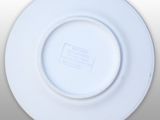 a white plate with a black and white label on it