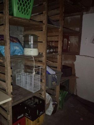 a shelf with a lot of items on it in a room