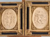 a pair of carved reliefs of a woman and a man
