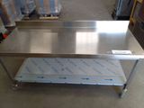 a stainless steel table with a shelf underneath it