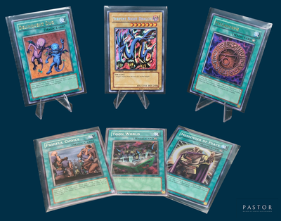 several cards are on display in plastic holders on a blue background