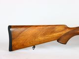 a wooden rifle on a white background with a white background