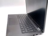 a laptop that is sitting on a white surface