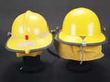 pair of yellow hard hats sitting on top of each other on a black surface
