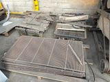 many pieces of metal that are laying on the ground