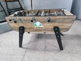 a foosball table in the corner of a room